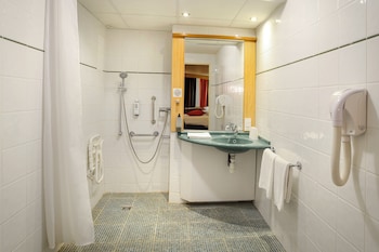 Accessible room with a double bed and a single bed