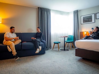 Junior Suite with Eiffel Tower View, 1 double bed and a double sofa bed.